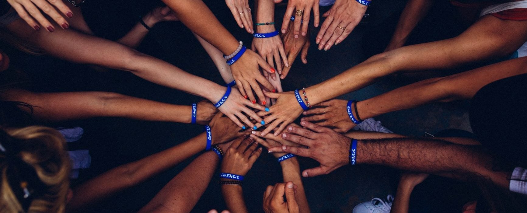 Hands coming together in a circle