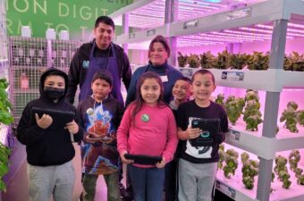 Educators Hector Magallanes and Barbara Pastuschek-Cox with students inside the hydroponic growing facility at San Andreas High.